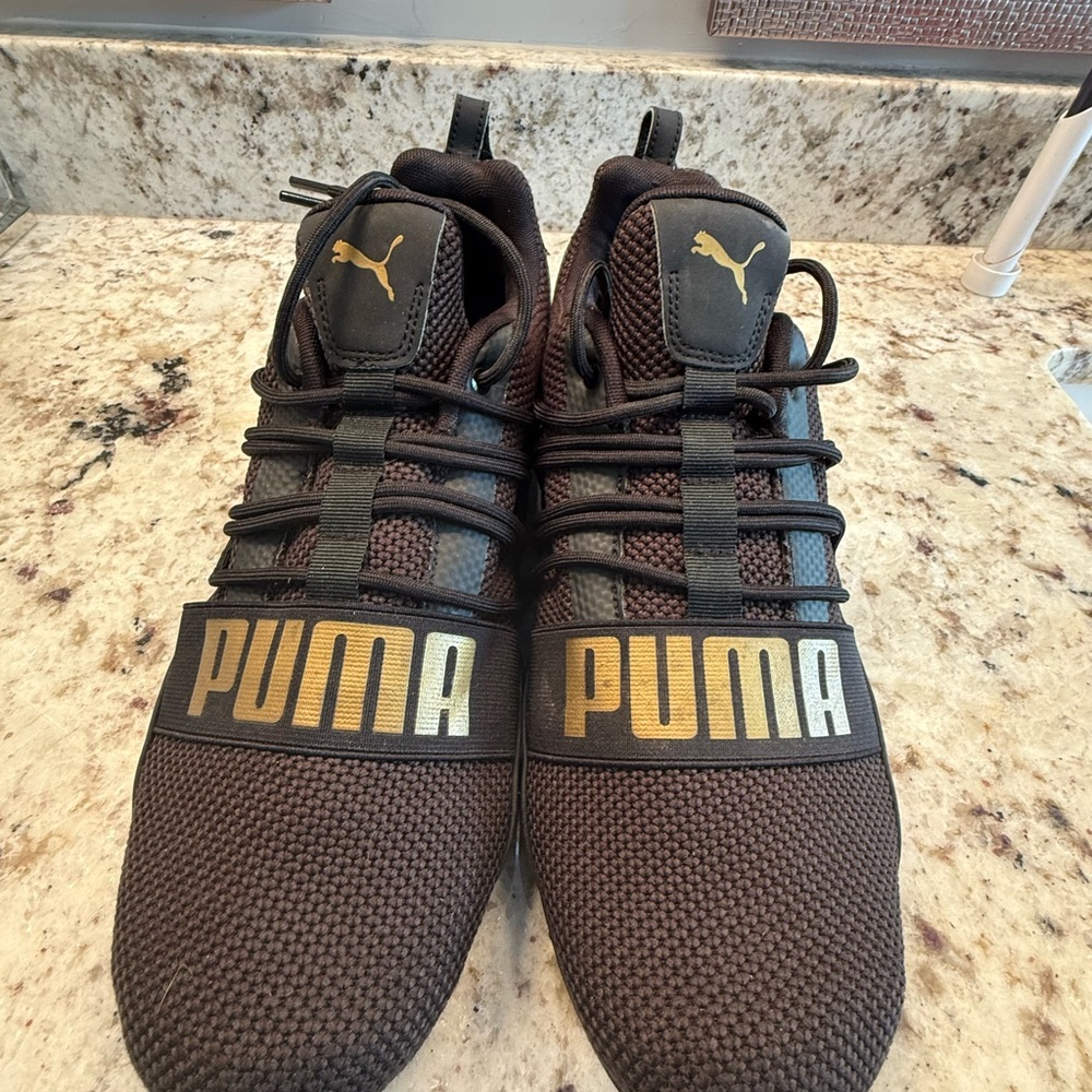 Puma Black Sneakers with Gold Highlights